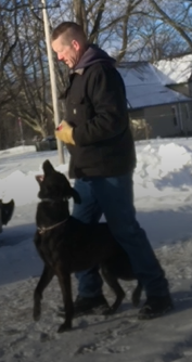 A man and a dog.
